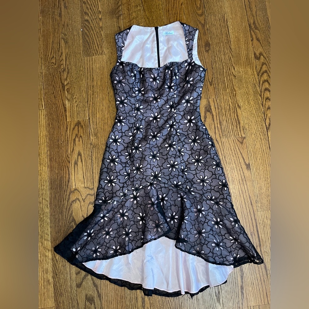 Midi dress with flower detail. Heart shaped top.